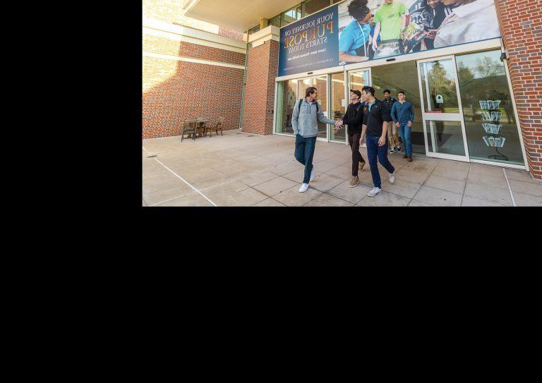 students walk outside the DUC